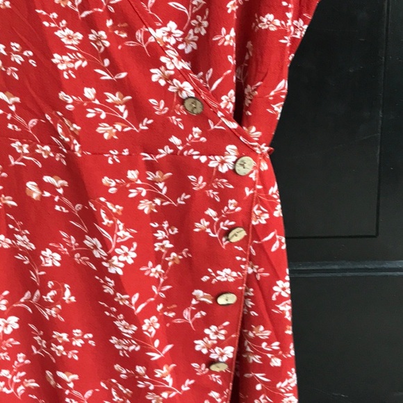 A beautiful rust color light weight dress with a cream colored floral pattern. - Picture 2 of 7